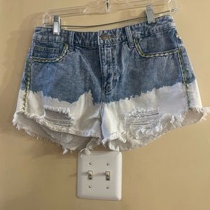 Free People distressed denim shorts, with unique details